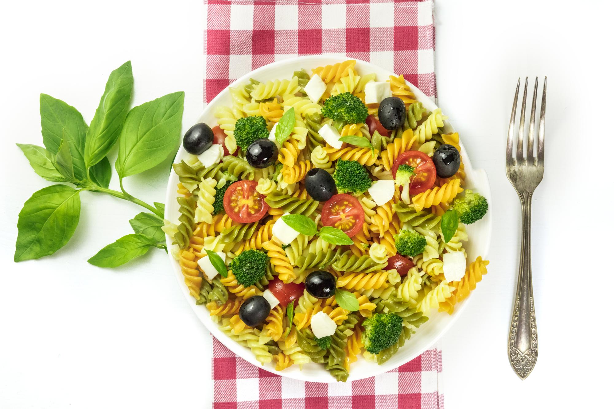 Bright plated pasta with herbs